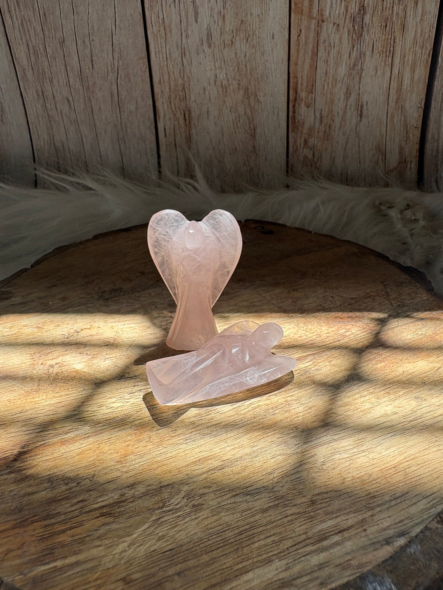 Rose quartz angel wings detail with smooth polished carving