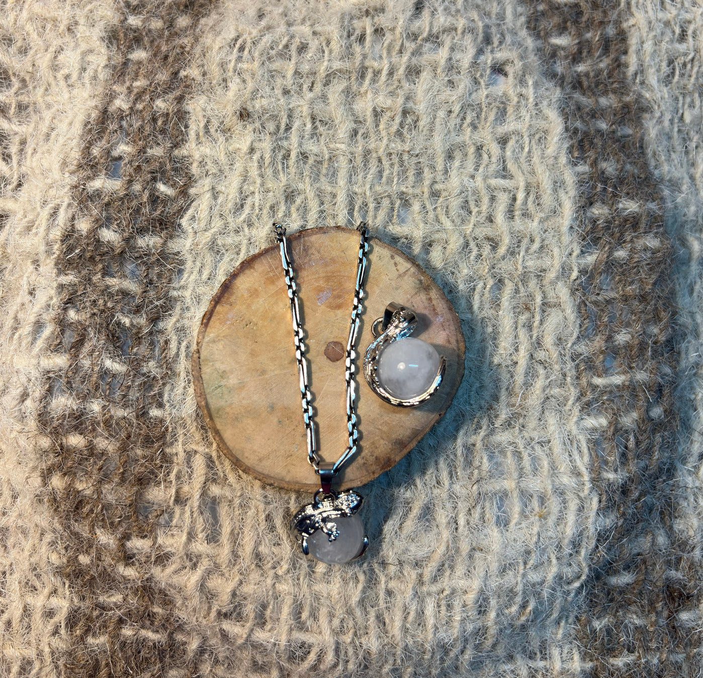 Clear Quartz crystal lizard pendant symbolizing transformation, healing, and higher consciousness
