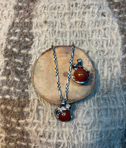Red Jasper crystal lizard necklace symbolizing resilience, grounding, and personal growth