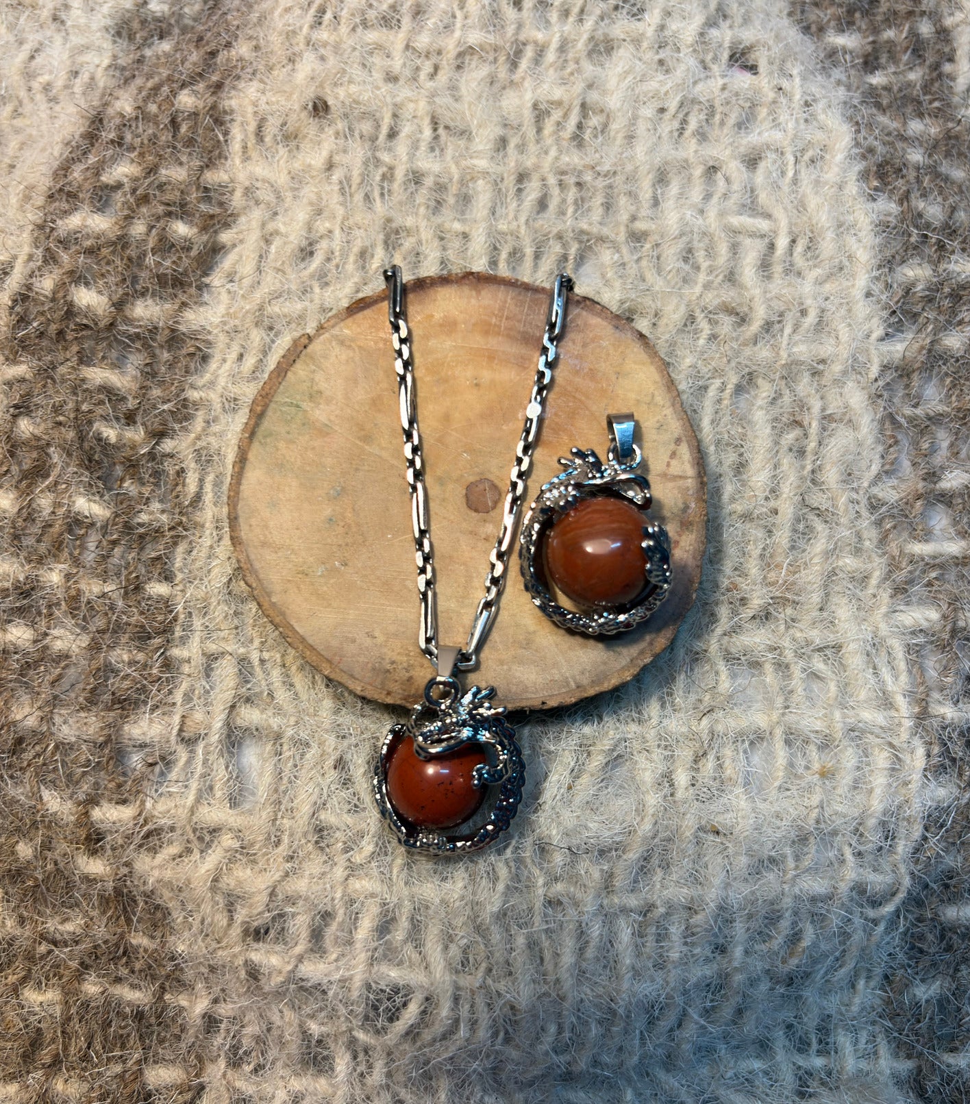 Red Jasper crystal dragon pendant symbolizing strength, protection, and vitality
