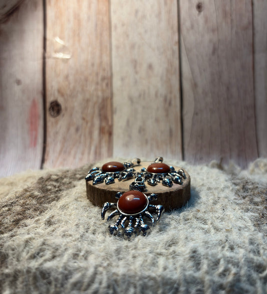 Red Jasper crystal skull necklace symbolizing courage, resilience, and transformation