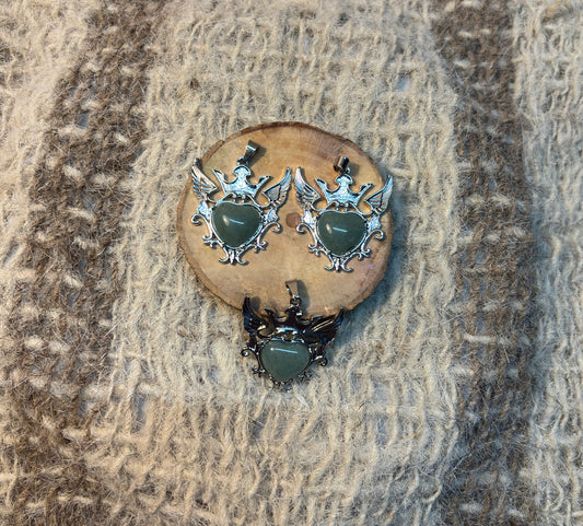 Green Aventurine crystal winged heart necklace symbolizing abundance, growth, and emotional healing