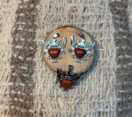 Red Jasper crystal winged heart necklace symbolizing stability, protection, and personal power