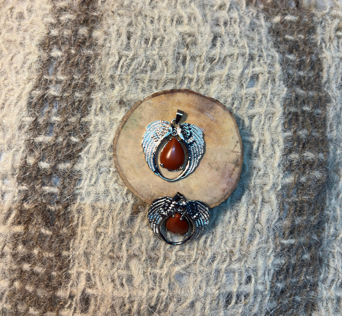 Red Jasper crystal angel pendant symbolizing courage, resilience, and spiritual support