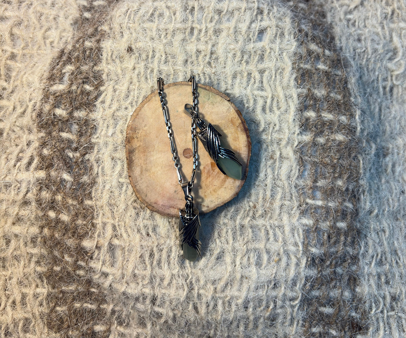 Green Aventurine crystal wings necklace symbolizing abundance, growth, and opportunity