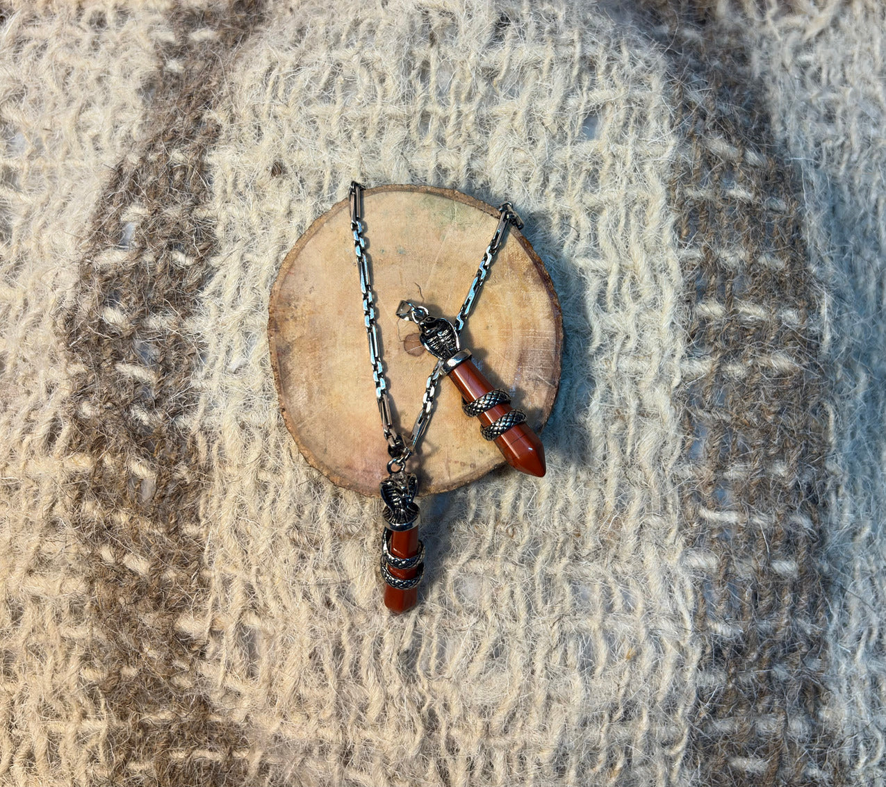 Red Jasper crystal snake necklace symbolizing strength, transformation, and resilience