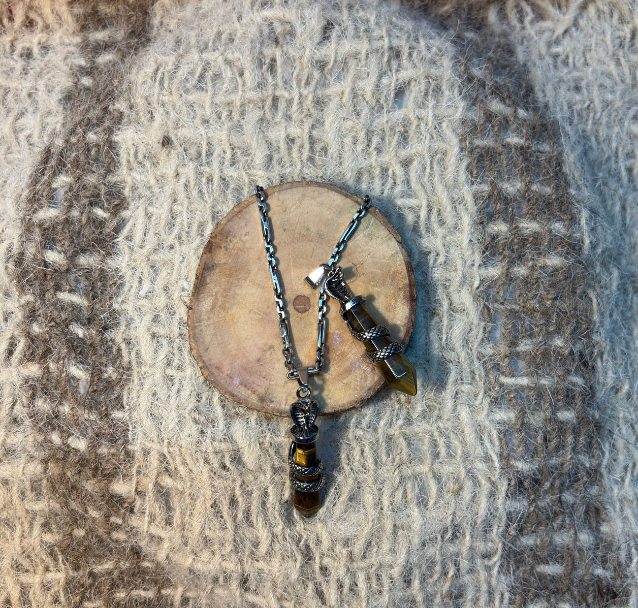 Tiger's Eye crystal snake necklace symbolizing courage, transformation, and achievement