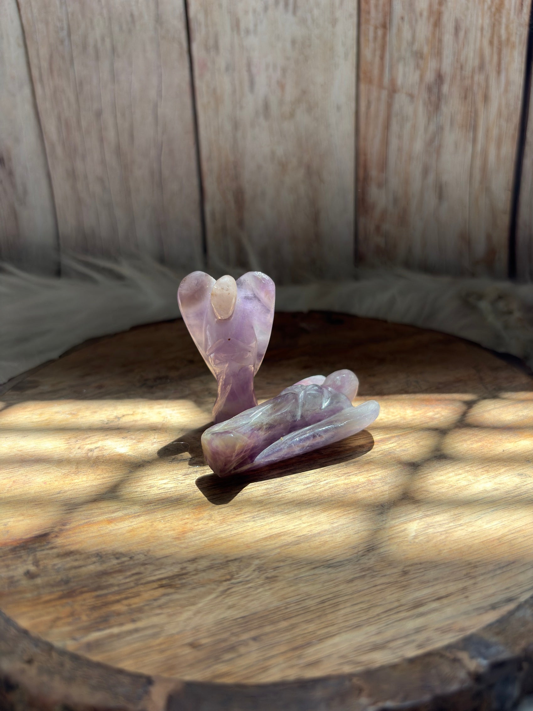 Amethyst angel wings detail with polished carving and natural stone