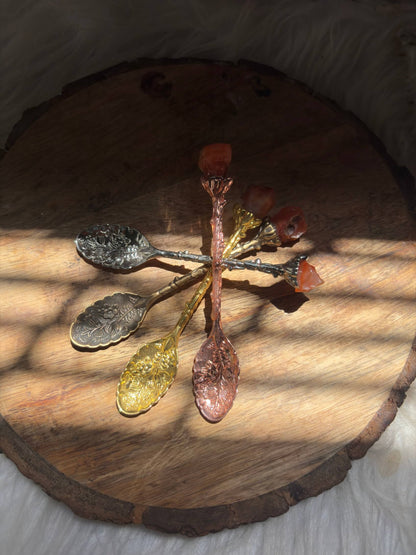 close up of natural carnelian crystal spoon showing texture and gemstone detail