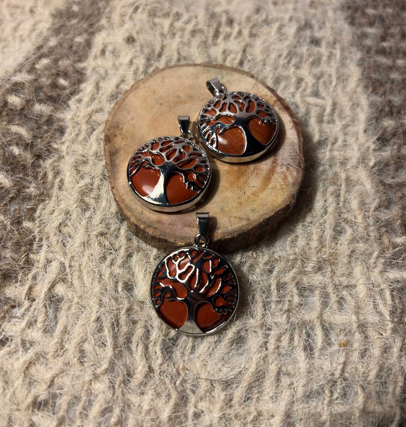 Red Jasper crystal pendant featuring Tree of Life design for grounding and confidence