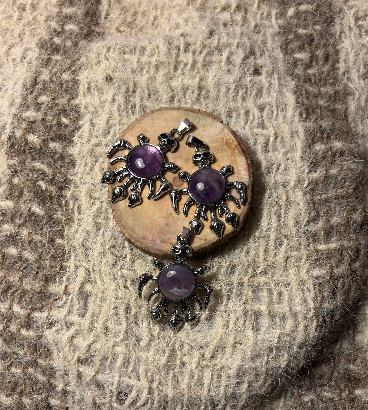 Amethyst crystal skull necklace symbolizing wisdom, healing, and spiritual growth