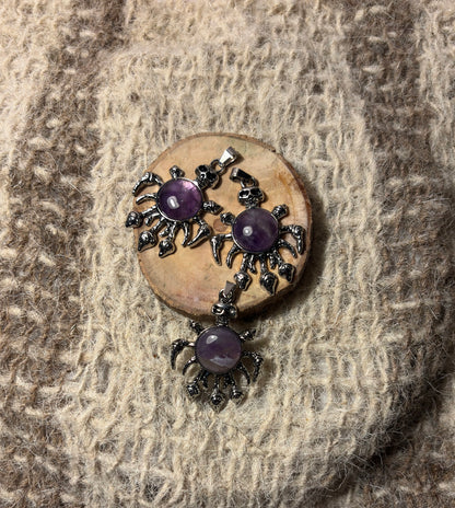 Amethyst crystal skull necklace symbolizing wisdom, healing, and spiritual growth