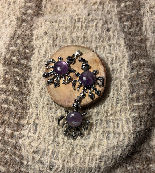 Amethyst crystal skull necklace symbolizing wisdom, healing, and spiritual growth