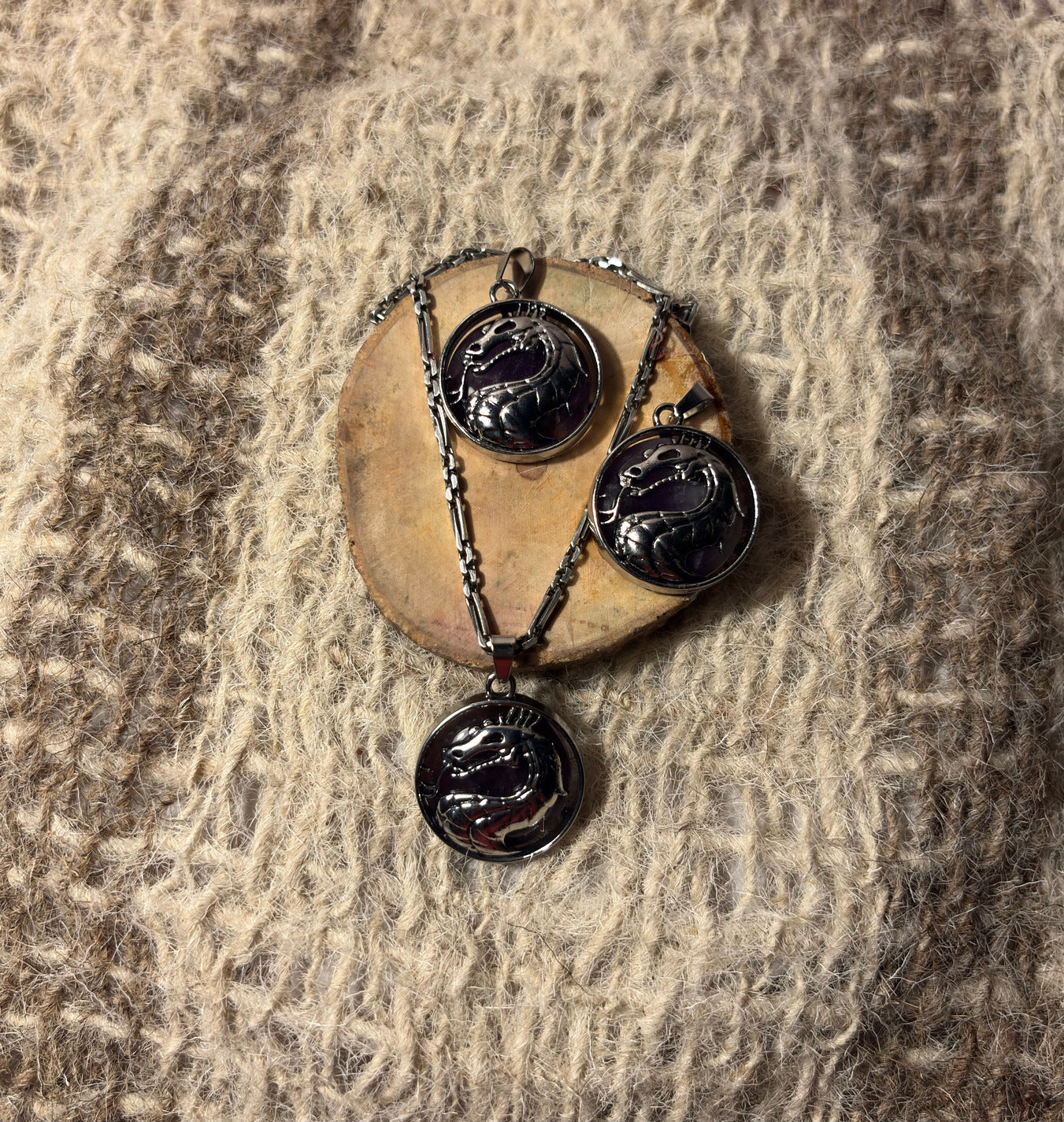 Amethyst crystal dragon necklace symbolizing wisdom, protection, and transformation