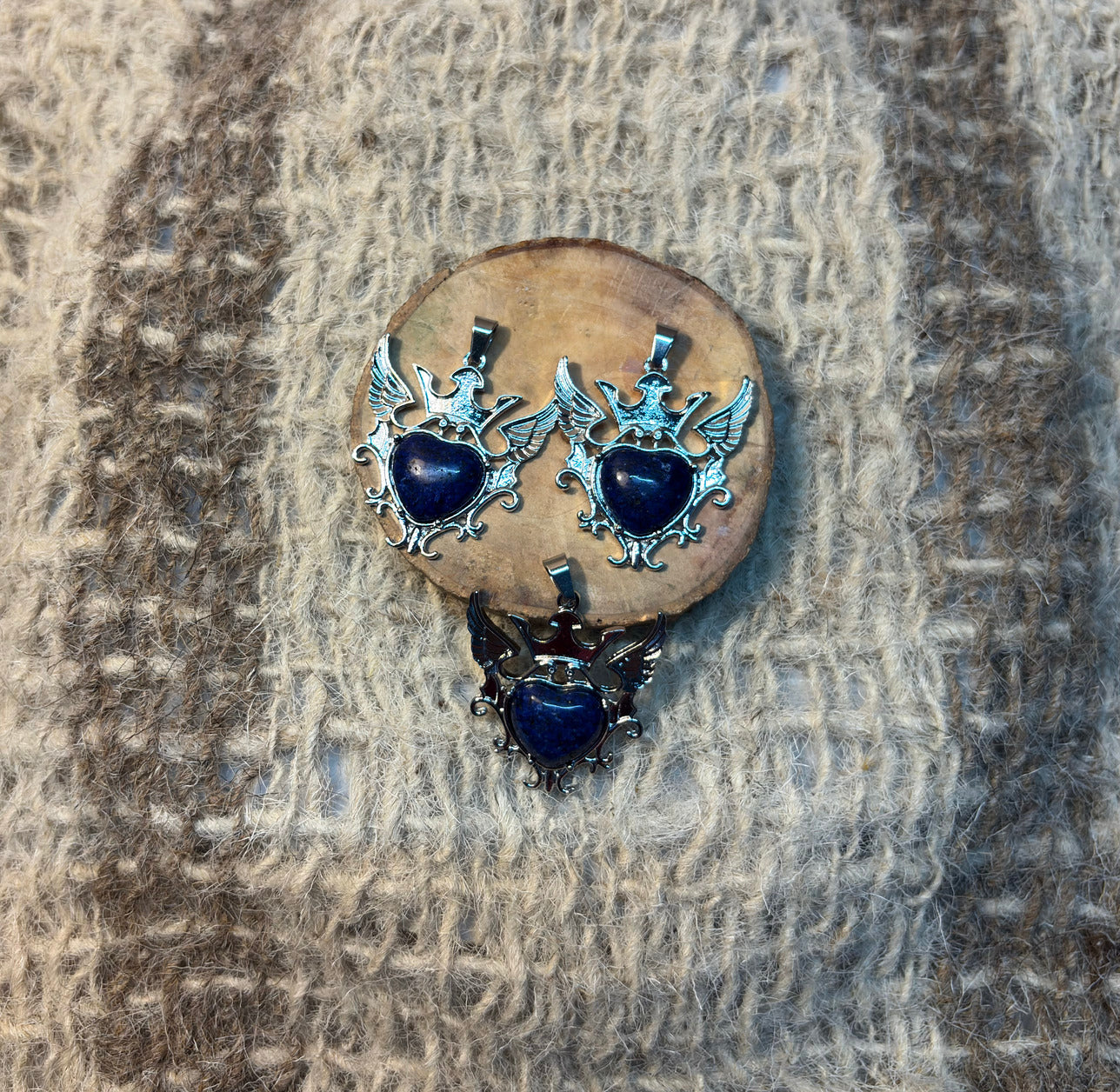 Lapis Lazuli crystal winged heart necklace symbolizing wisdom, protection, and self-expression