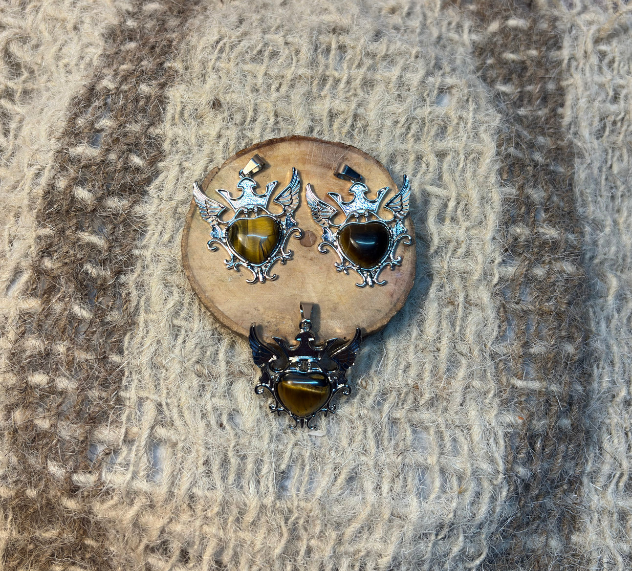 Tiger's Eye crystal winged heart necklace symbolizing courage, strength, and abundance