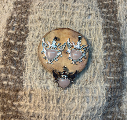 Rose Quartz crystal winged heart necklace symbolizing love, healing, and compassion