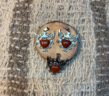 Red Jasper crystal winged heart necklace symbolizing stability, protection, and personal power