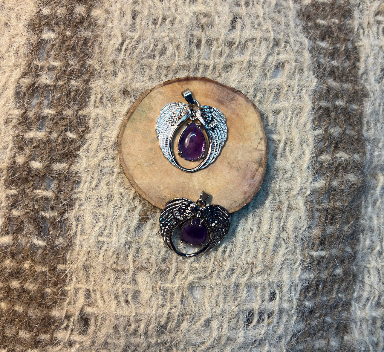 Amethyst crystal angel pendant symbolizing healing, guidance, and spiritual growth