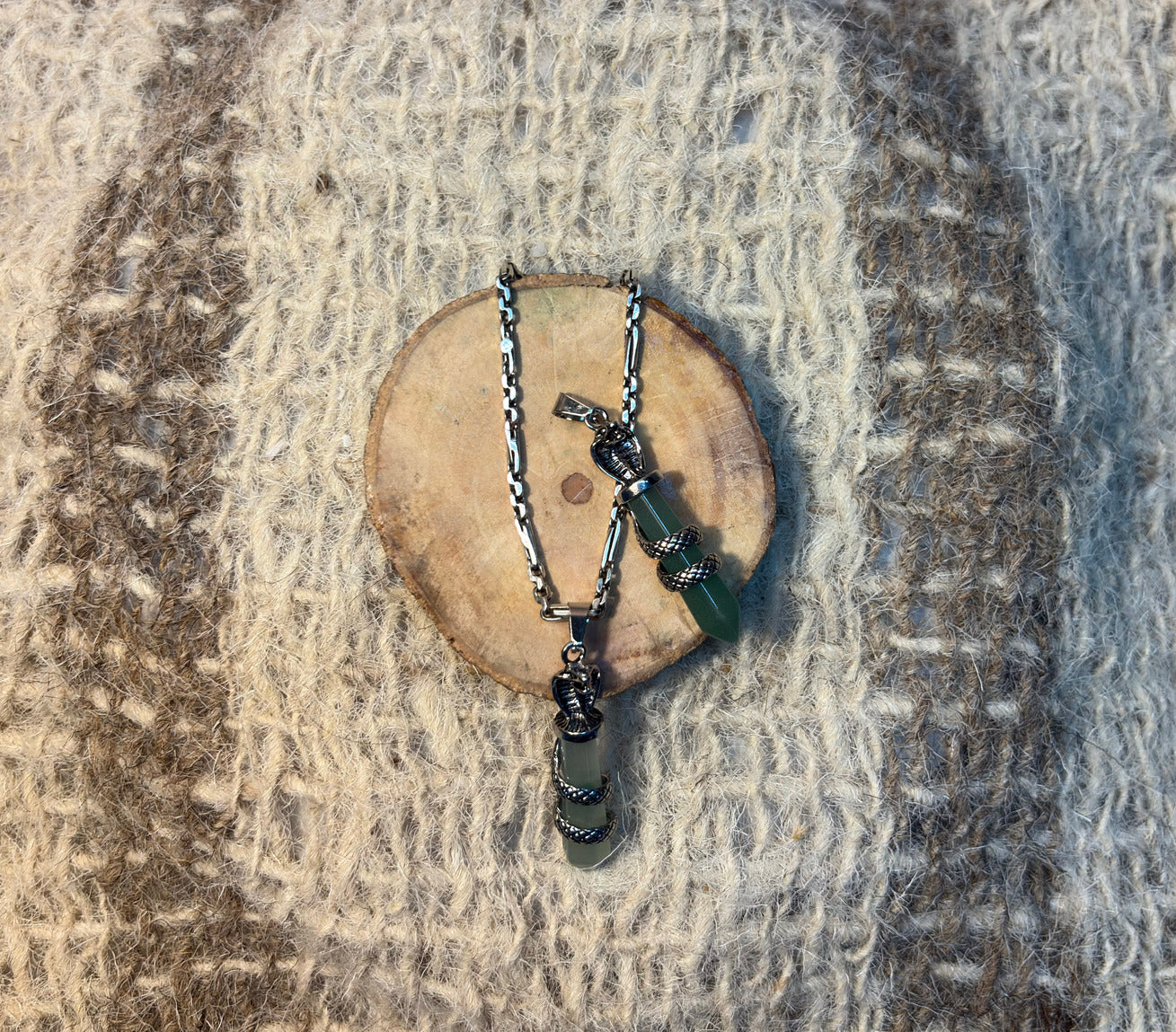 Green Aventurine crystal snake necklace symbolizing transformation and abundance