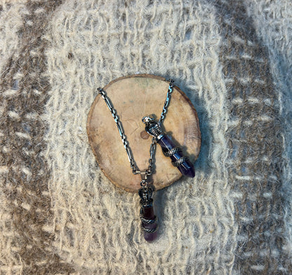 Amethyst crystal snake necklace symbolizing wisdom, transformation, and spiritual awakening