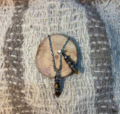 Tiger's Eye crystal snake necklace symbolizing courage, transformation, and achievement