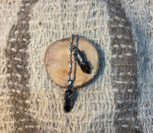 Tiger's Eye crystal wings necklace symbolizing courage, strength, and achievement